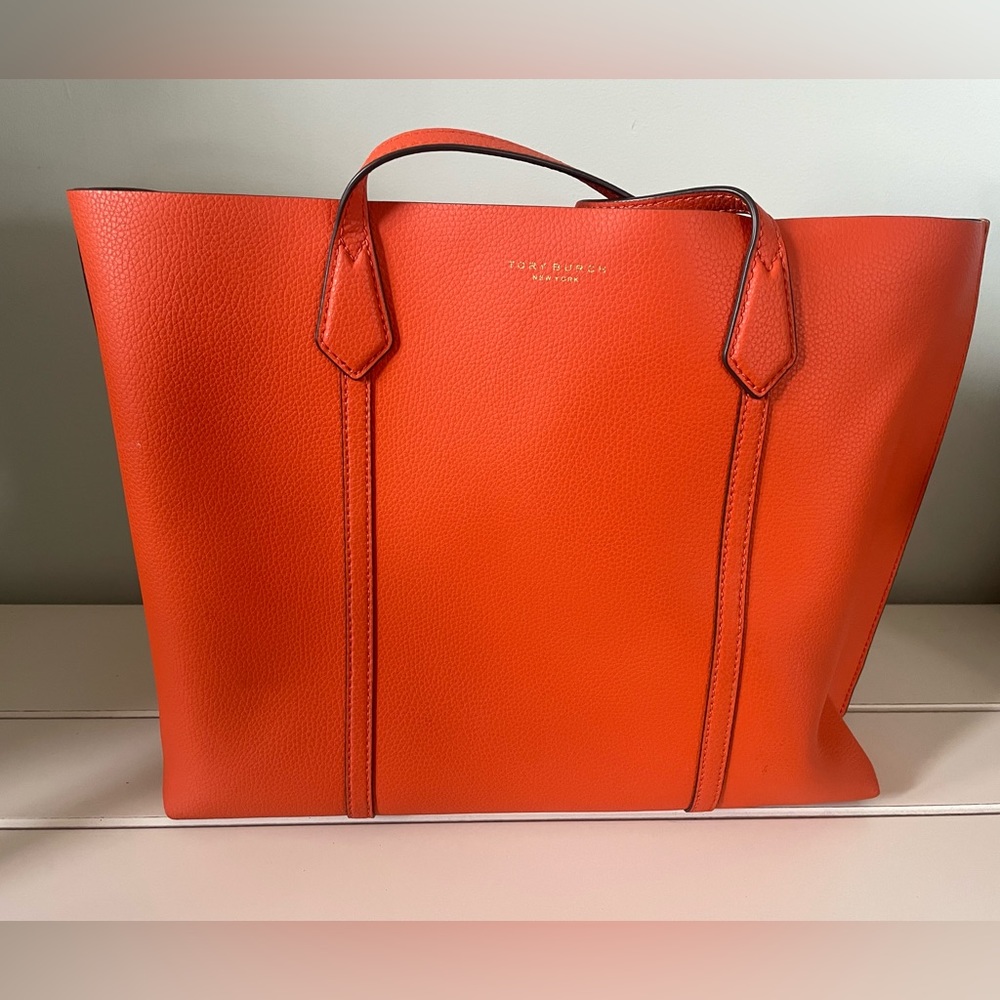 Tory Burch Perry triple compartment orange tote bag.